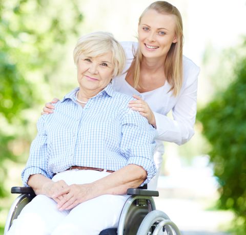 Woman in wheelchair with younger woman behind her, smiling | Skilled Nursing Care in Pottsville